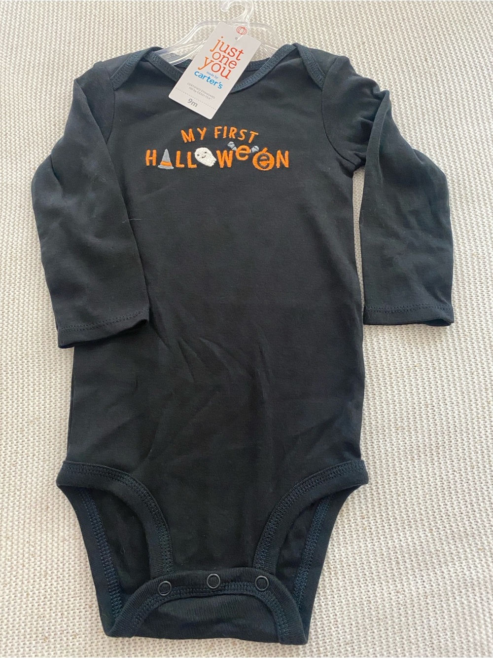 Carter’s first Halloween onesie